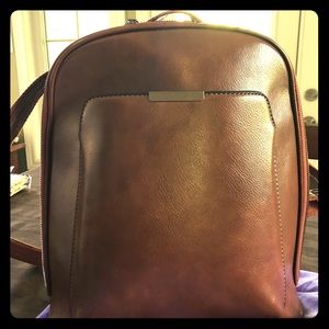 Multi pocket shoulder purse to back pack.